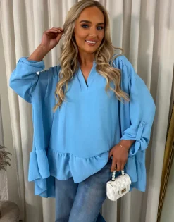 Blue Ruby V-Neck High Low Ruffle Hem Oversized Top<IKRUSH New